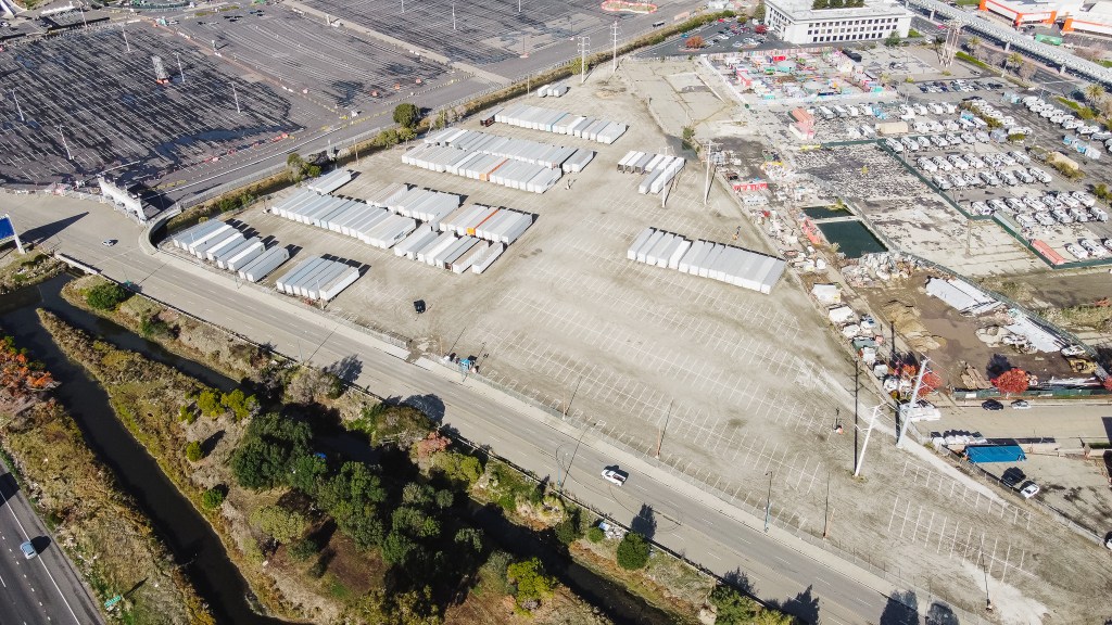 The image displays an aerial view of the Malibu Lot.